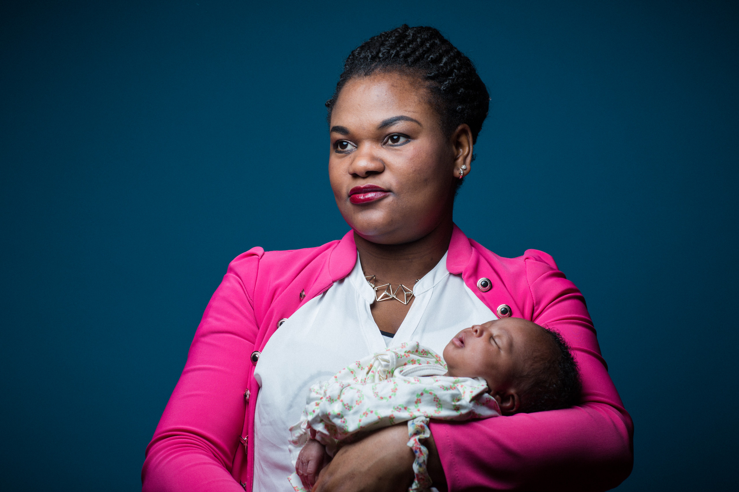 A mother with jer newborn child. Refugees in an asylum center in Essen Germany. Portrait by Martin Thaulow