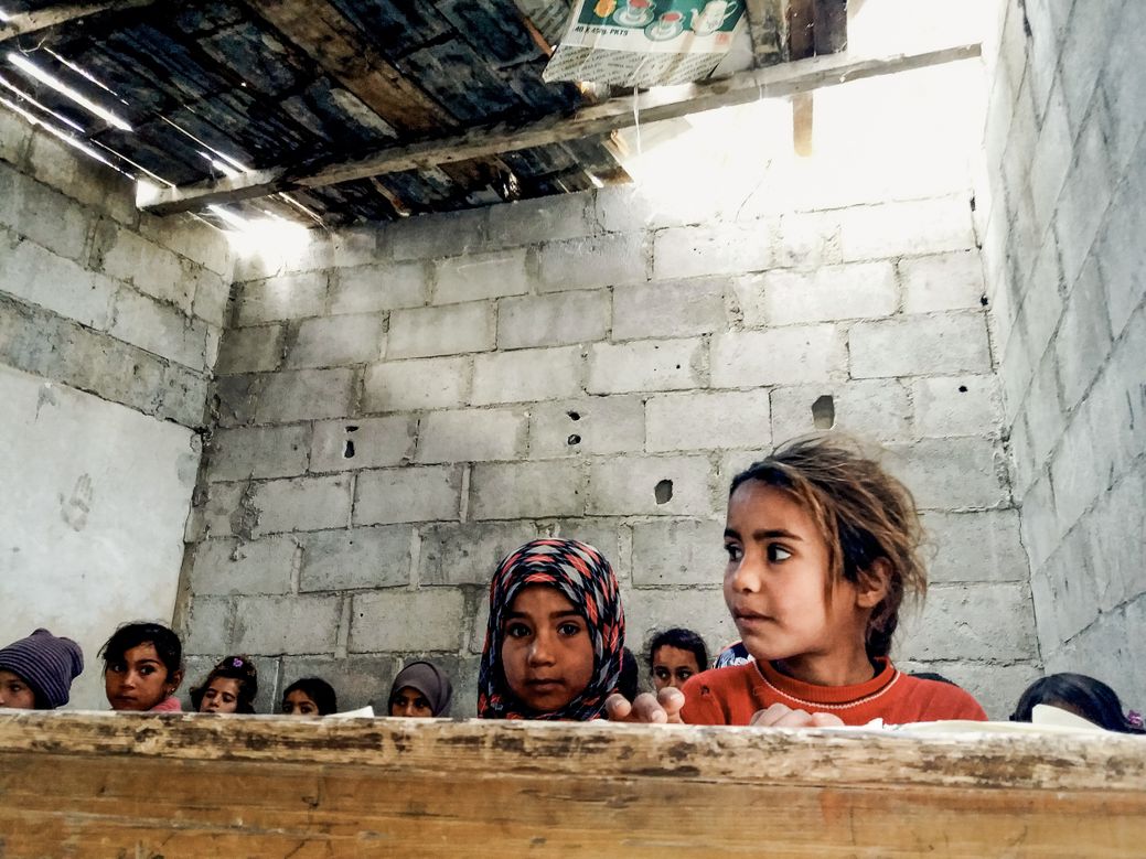 Photo by Salem Mdlala. A group of girls hiding in Ghouta.