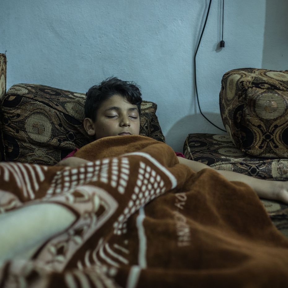 One of Mohammed's sons sleeping in their home in Jordan.