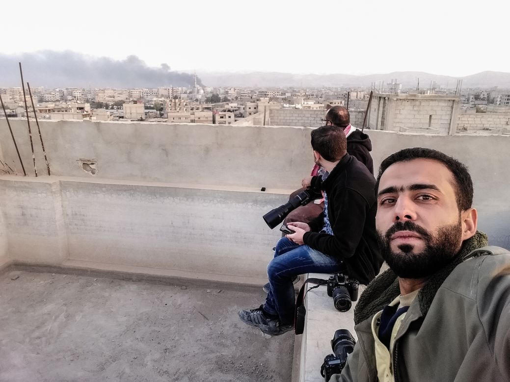 Salem Mdlala and fellow photographers in Ghouta. 