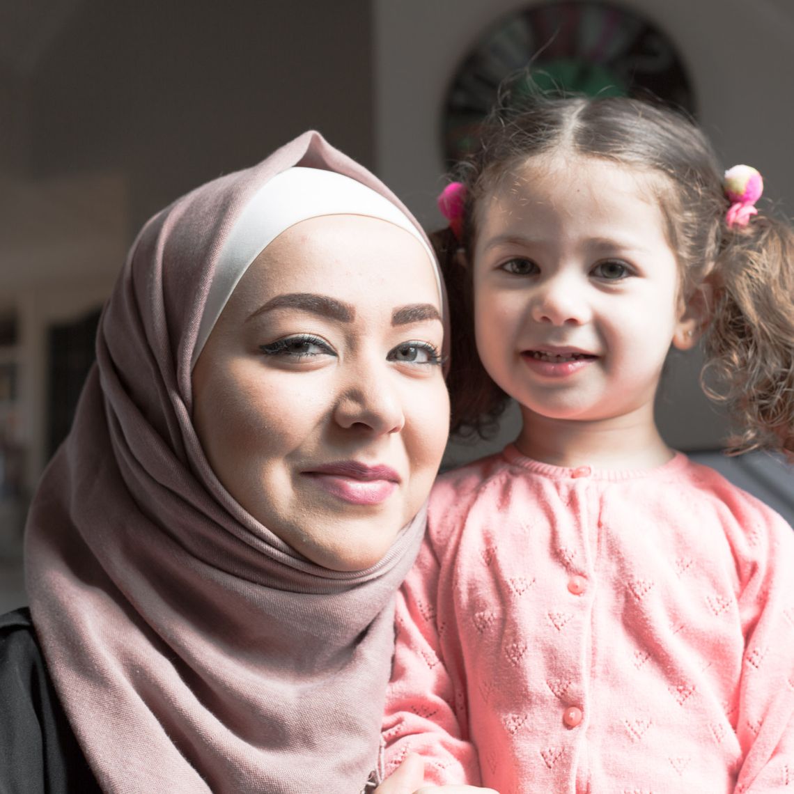 Wael's wife and daughter standing next to each other and smiling