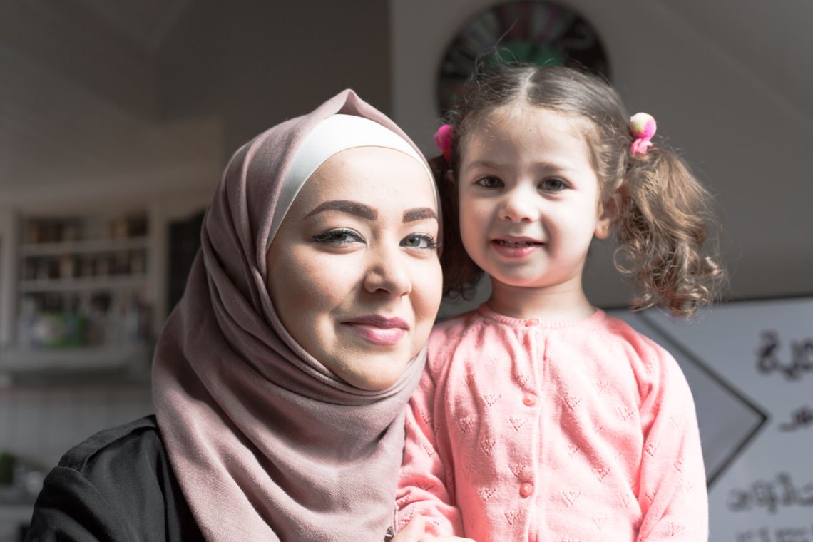 Wael's wife and daughter standing next to each other and smiling